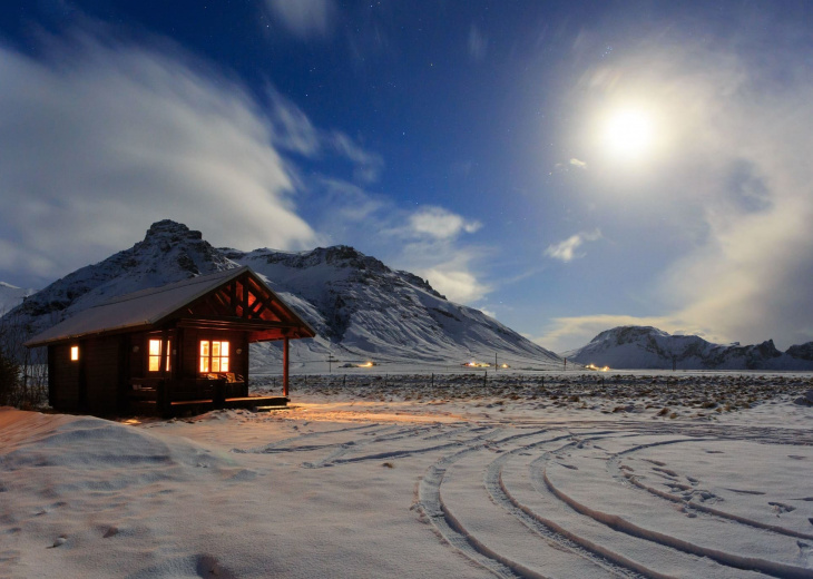 Cottage in mountains in the moonlight