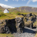 Snæfellsnes peninsula, Small farmhouse standing close to some cliffs by the sea