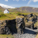 Snæfellsnes peninsula, Small farmhouse standing close to some cliffs by the sea