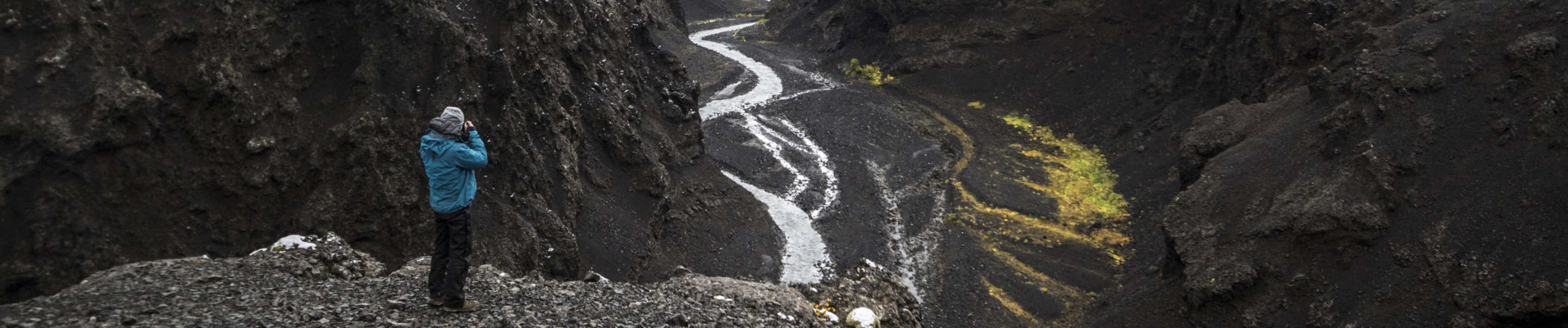 Things to do in Iceland - man photographing volcanic landscape