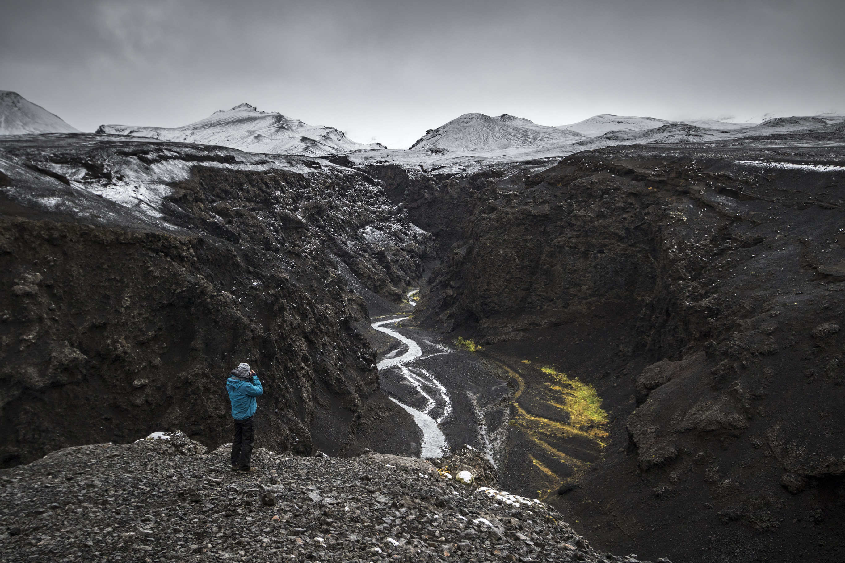 Things to do in Iceland - man photographing volcanic landscape