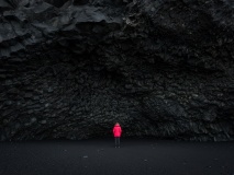 Woman under Halsanefshellir Cave in Iceland