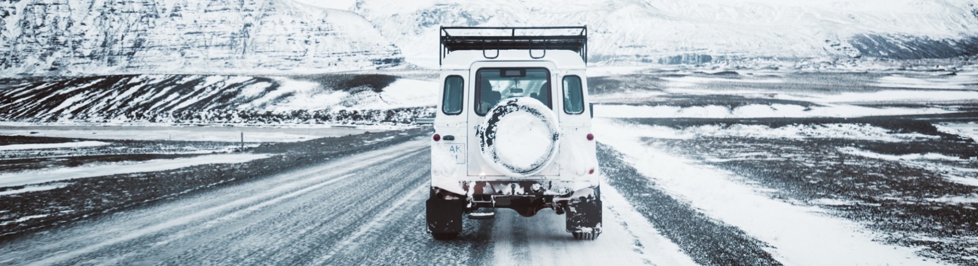 car on winter road in Iceland