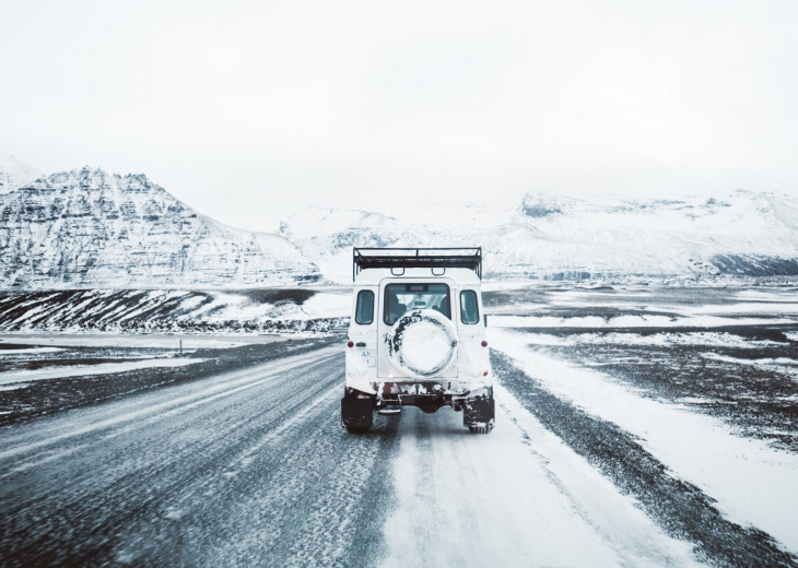 car on winter road in Iceland